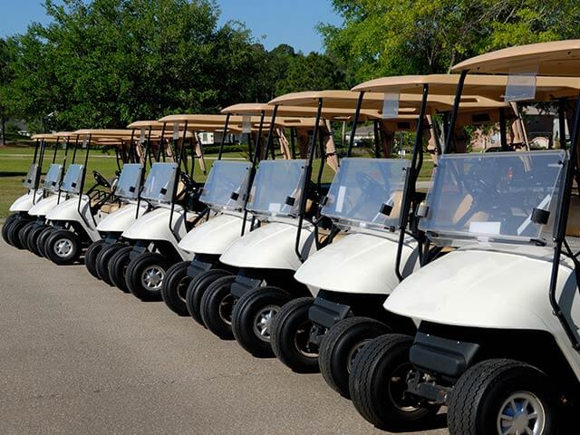 A line of golf buggies